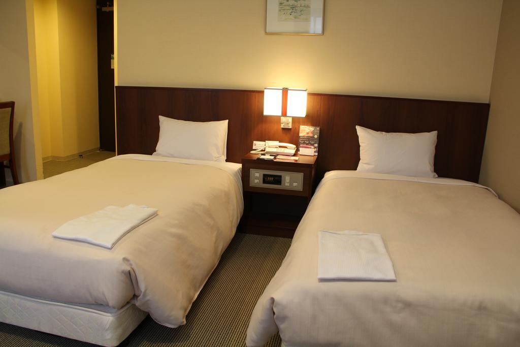 Hotel Sunroute New Sapporo Quarto foto