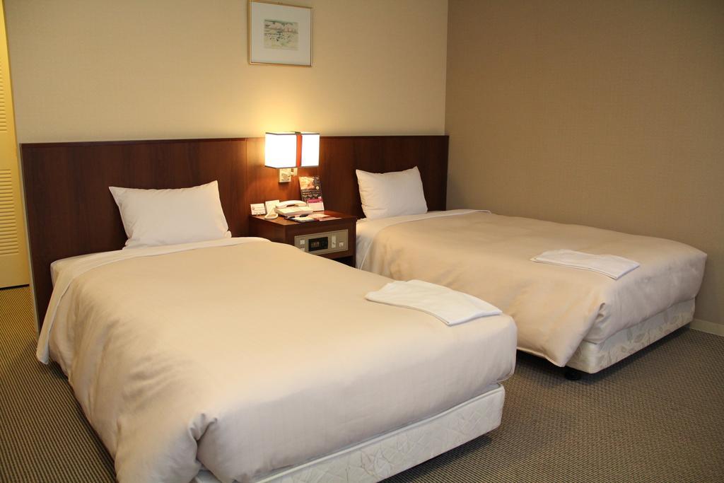 Hotel Sunroute New Sapporo Quarto foto