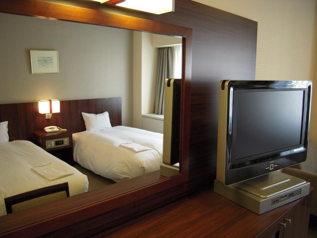 Hotel Sunroute New Sapporo Quarto foto